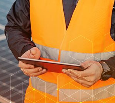Solar Technician standing in front of a Solar Installation